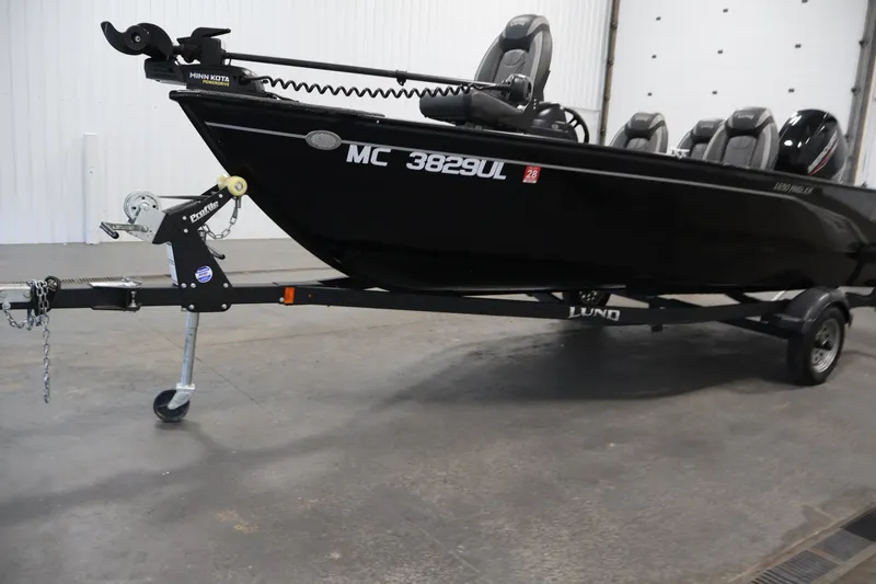 Slide: The Image of 2020 Lund 1650 Angler SS fishing boat on trailer in indoor setting. - 40