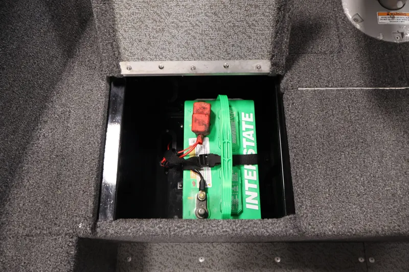 Slide: The Image of 2020 Lund 1650 Angler SS boat battery compartment with Interstate battery. - 19