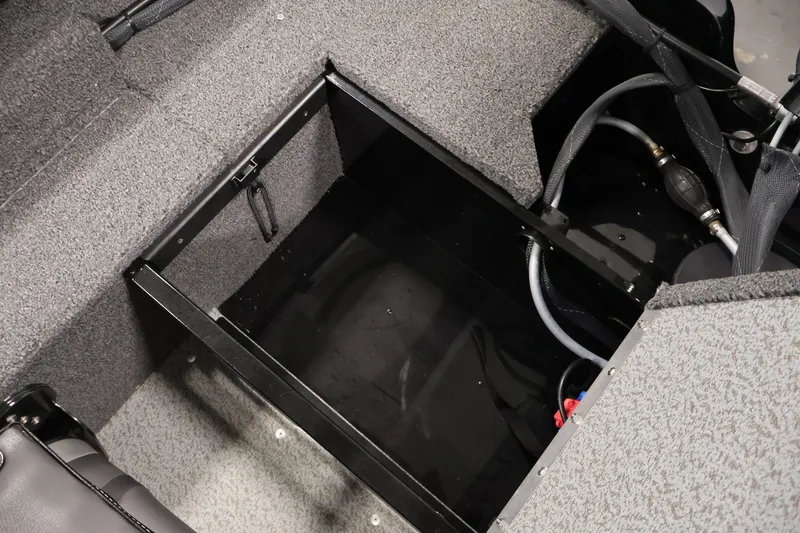 Slide: The Image of 2020 Lund 1650 Angler SS boat interior storage compartment with carpeted finish. - 34