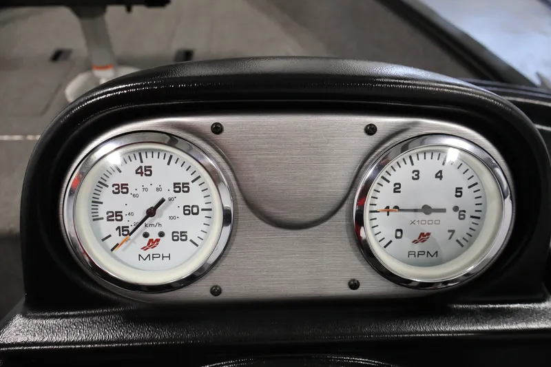 Slide: The Image of Dashboard of a 2020 Lund 1650 Angler SS boat showing speedometer and tachometer. - 25