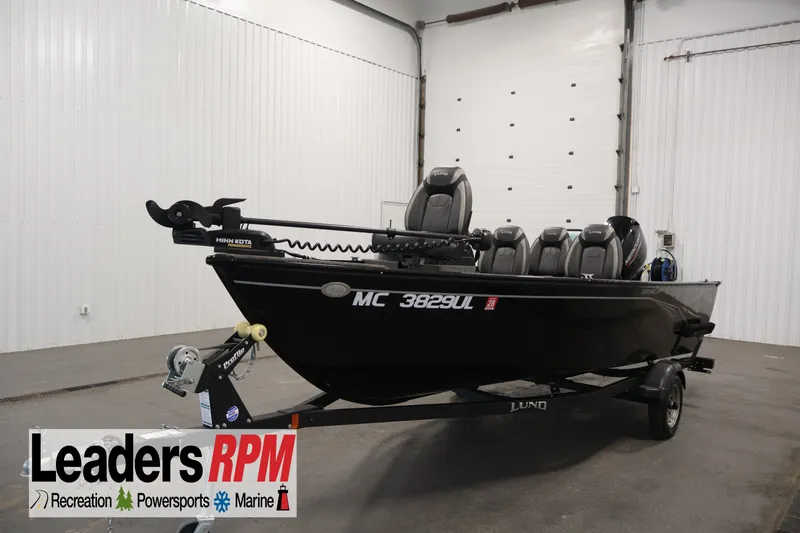 The Image of 2020 Lund 1650 Angler SS fishing boat in showroom with trailer and motor. - 1