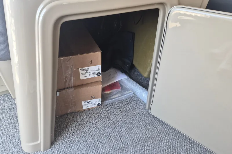 Slide: The Image of Storage compartment in 2026 Sylvan X3 DLZ DH BAR with boxes and packaging materials. - 8
