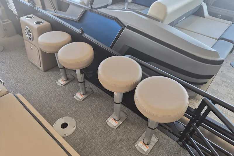 Slide: The Image of Four bar stools on a 2026 Sylvan X3 DLZ DH BAR boat interior. - 18