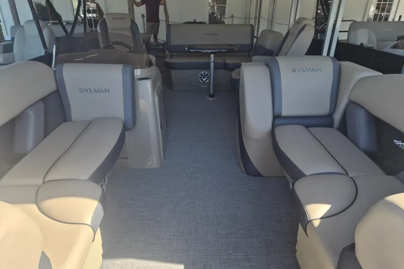 Slide: The Image of Luxurious interior of 2026 Sylvan X3 DLZ DH BAR pontoon boat with plush seating. - 2