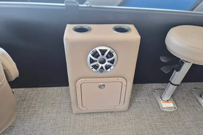Slide: The Image of 2026 Sylvan X3 DLZ DH BAR boat interior with speaker and cup holders. - 13