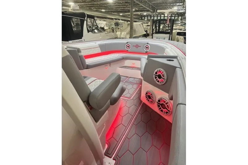 Slide: The Image of 2025 Fountain 34 SC boat interior with red LED lighting and modern seating. - 30