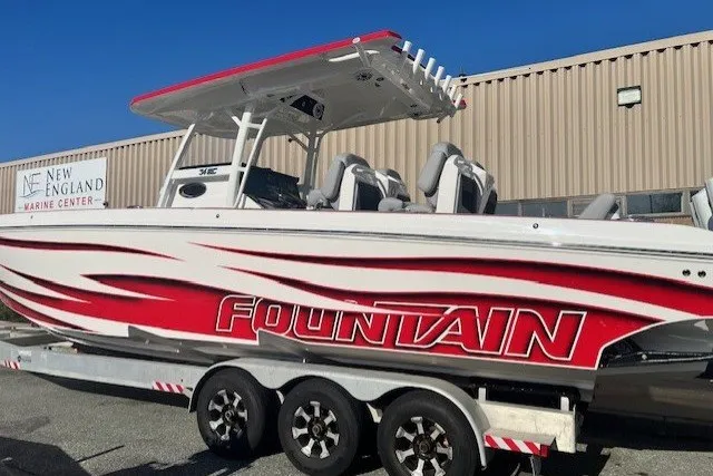 Slide: The Image of 2025 Fountain 34 SC boat with red and white design at New England Marine Center. - 3