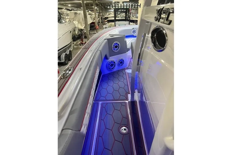 Slide: The Image of 2025 Fountain 34 SC boat interior with hexagonal flooring and blue LED lighting. - 22