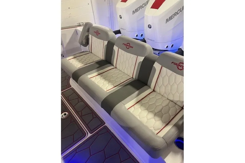 Slide: The Image of 2025 Fountain 34 SC boat interior with stylish seating and Mercury engines. - 17