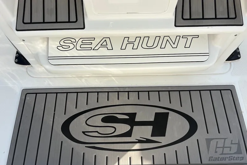 Slide: The Image of 2022 Sea Hunt Ultra 275SE boat deck with logo and GatorStep flooring. - 14