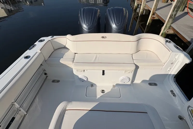 Slide: The Image of 2022 Sea Hunt Ultra 275SE boat interior with seating and twin engines. - 5