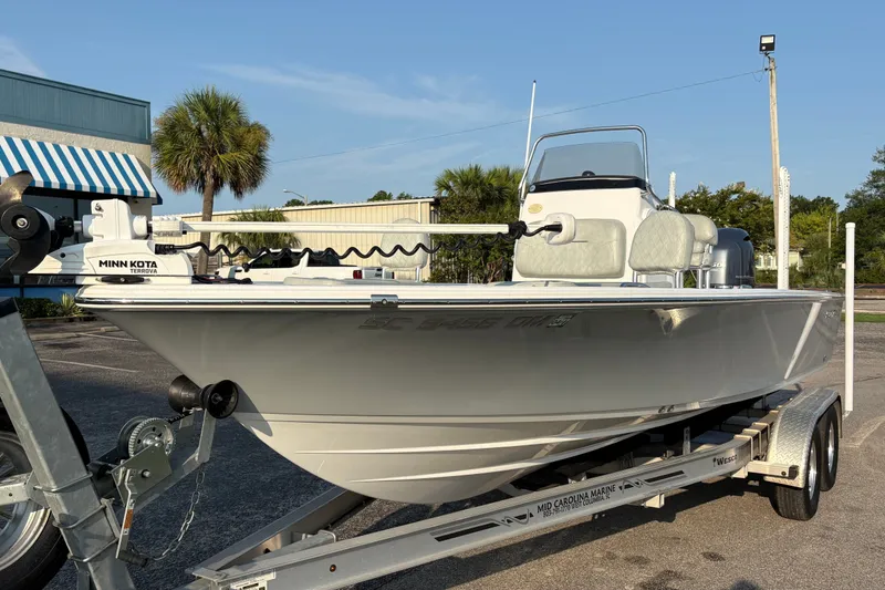 Slide: The Image of 2019 Sportsman Masters 227 Bay Boat on trailer, featuring Minn Kota Terrova motor. - 7