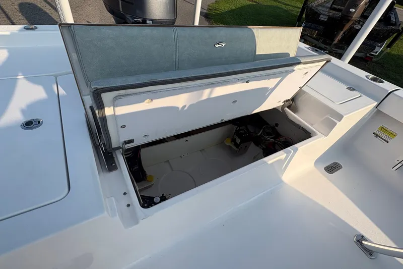Slide: The Image of 2019 Sportsman Masters 227 Bay Boat with open storage compartment on deck. - 9