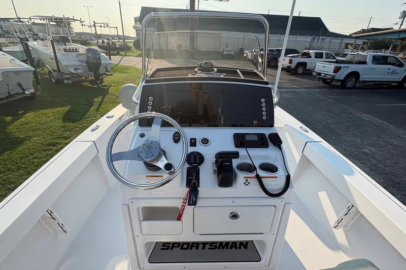 Slide: The Image of 2019 Sportsman Masters 227 Bay Boat dashboard with steering wheel and controls. - 14