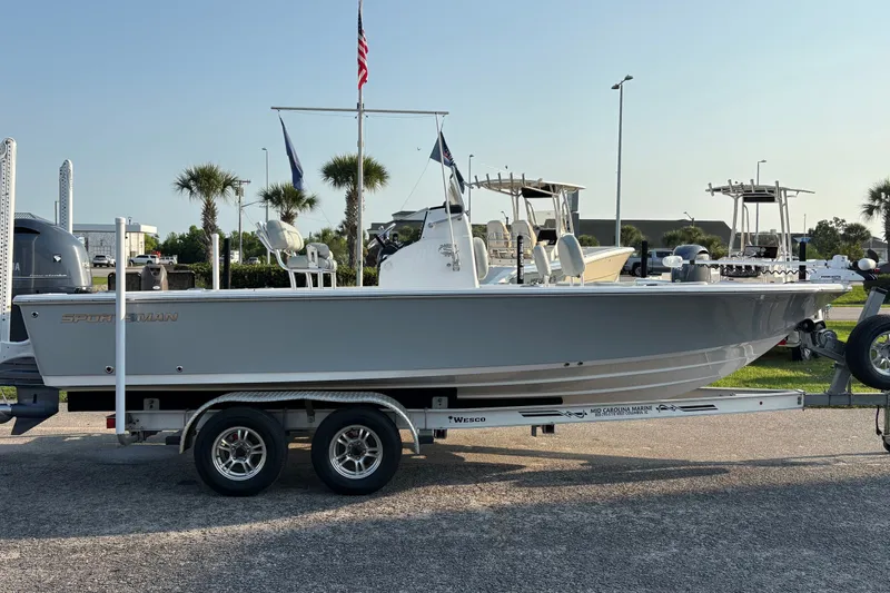 Slide: The Image of 2019 Sportsman Masters 227 Bay Boat on trailer, parked outdoors. - 4
