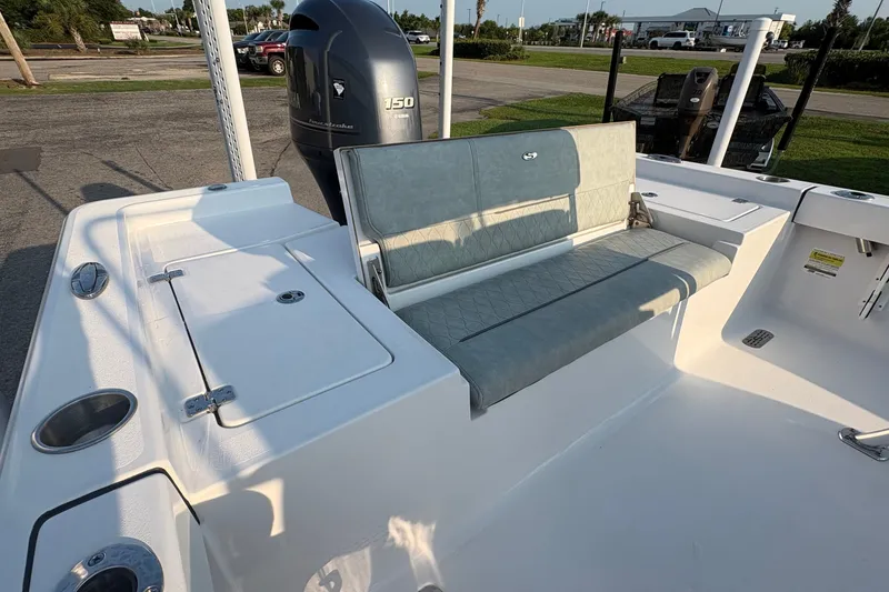 Slide: The Image of 2019 Sportsman Masters 227 Bay Boat interior with seating and Yamaha 150 engine. - 8