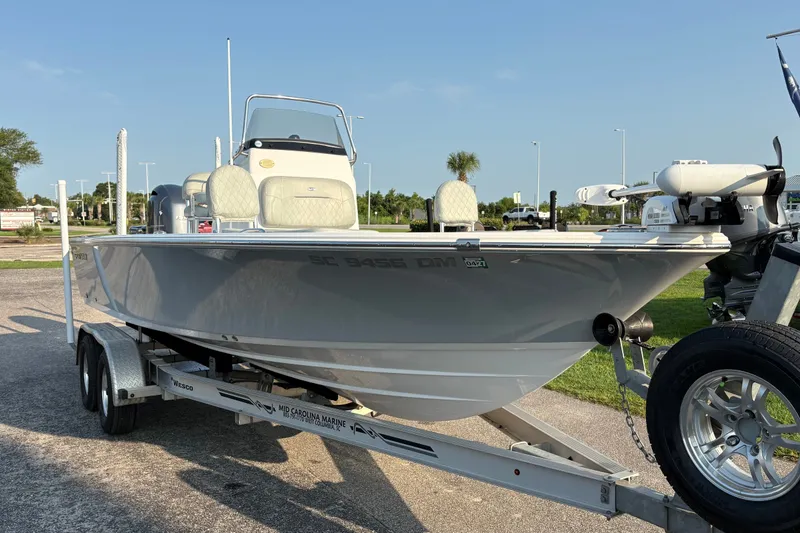 Slide: The Image of 2019 Sportsman Masters 227 Bay Boat on trailer, parked outdoors. - 5