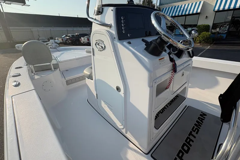 Slide: The Image of 2019 Sportsman Masters 227 Bay Boat interior with steering console and seating. - 17