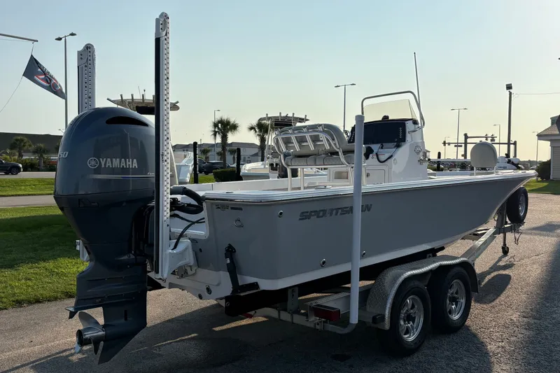 Slide: The Image of 2019 Sportsman Masters 227 Bay Boat with Yamaha engine on trailer, parked outdoors. - 3