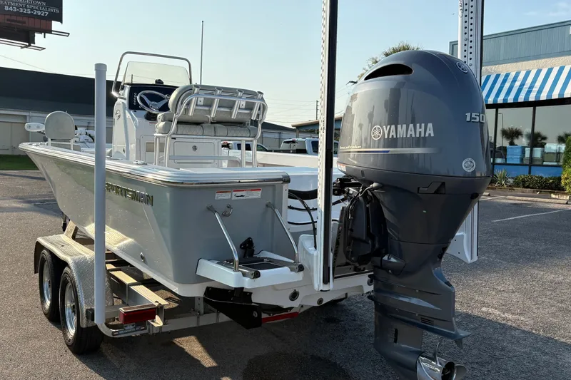 Slide: The Image of 2019 Sportsman Masters 227 Bay Boat with Yamaha 150 engine on trailer. - 2