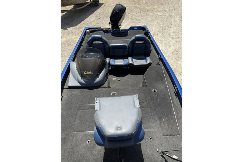 Slide: The Image of 2014 Lowe Stinger 175 boat interior with seating and console, viewed from above. - 8