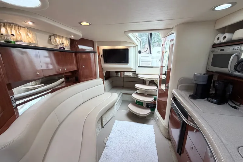 Slide: The Image of Luxurious interior of a 2006 Sea Ray Sundancer 320 yacht with modern amenities. - 23
