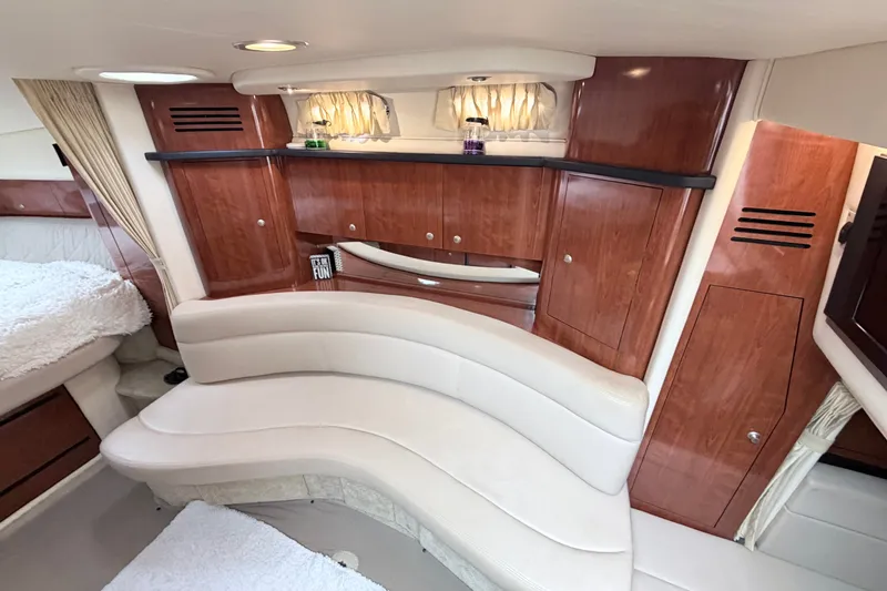 Slide: The Image of Interior of 2006 Sea Ray Sundancer 320 yacht with elegant wood cabinetry and plush seating. - 21