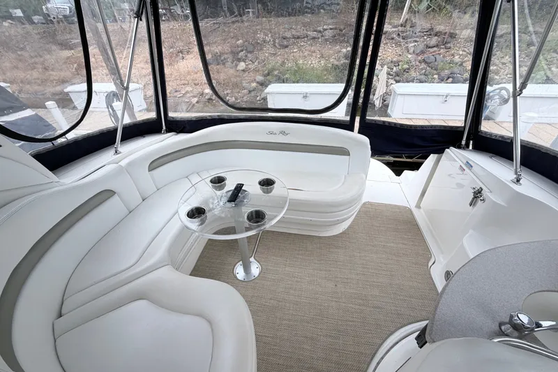 Slide: The Image of Luxurious 2006 Sea Ray Sundancer 320 interior with plush seating and glass table. - 15