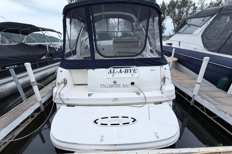 Slide: The Image of 2006 Sea Ray Sundancer 320 docked at marina, rear view with canopy. - 3