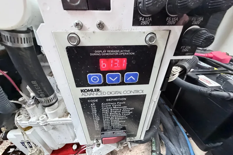 Slide: The Image of Kohler generator control panel on 2006 Sea Ray Sundancer 320, displaying 613.1 hours. - 43