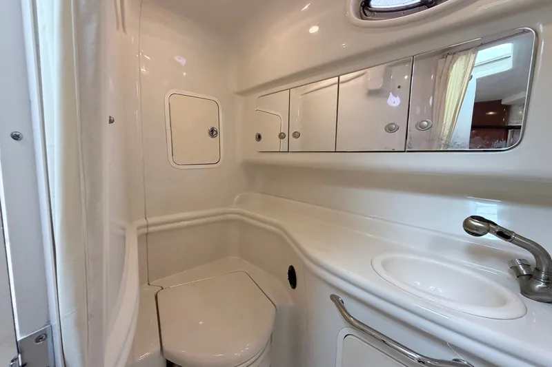 Slide: The Image of Luxurious bathroom in 2006 Sea Ray Sundancer 320 yacht with sink, mirror, and storage. - 30
