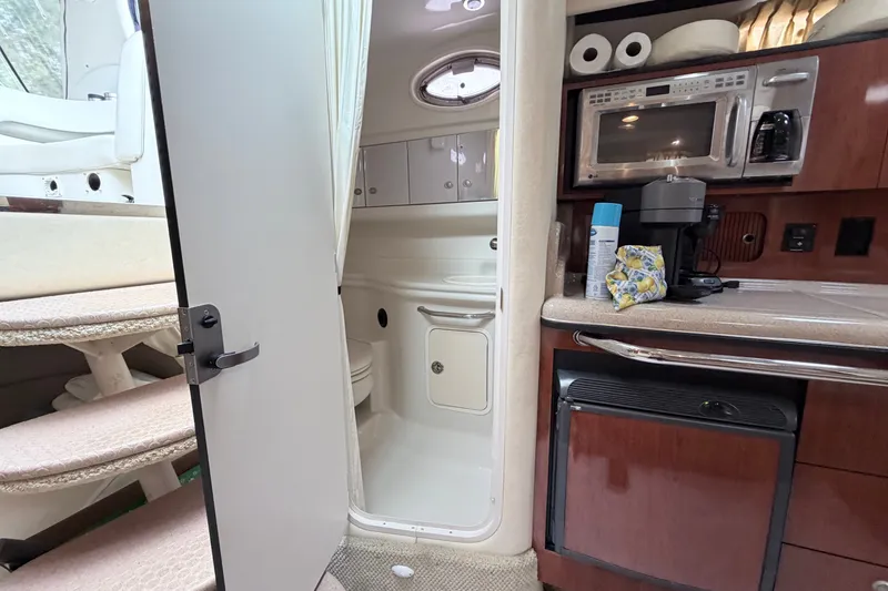 Slide: The Image of Interior of 2006 Sea Ray Sundancer 320 yacht with kitchenette and bathroom. - 28