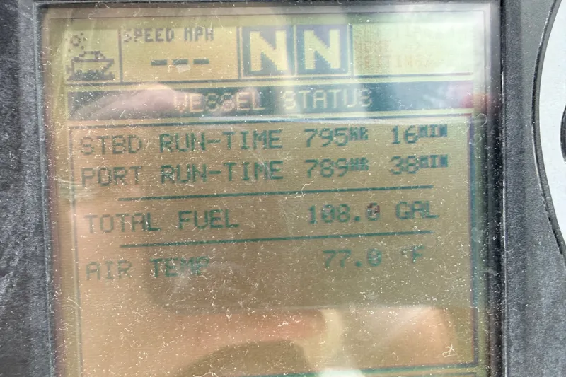 Slide: The Image of Display screen showing vessel status for 2006 Sea Ray Sundancer 320, including run-time and fuel data. - 44