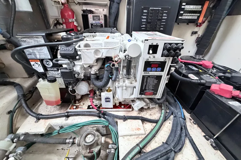 Slide: The Image of Engine compartment of a 2006 Sea Ray Sundancer 320 with Kohler generator and wiring. - 42