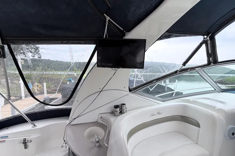 Slide: The Image of Interior of 2006 Sea Ray Sundancer 320 yacht with seating and mounted TV. - 14