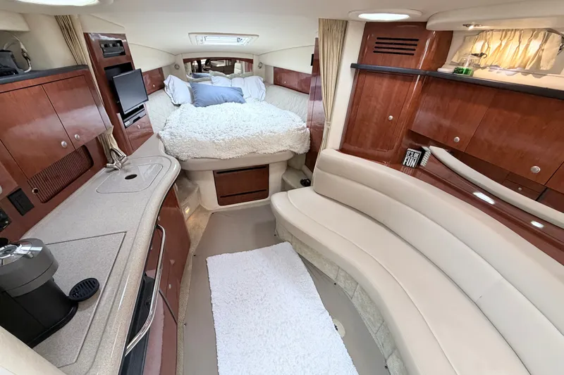 Slide: The Image of Luxurious 2006 Sea Ray Sundancer 320 cabin interior with cozy bed and elegant seating. - 18