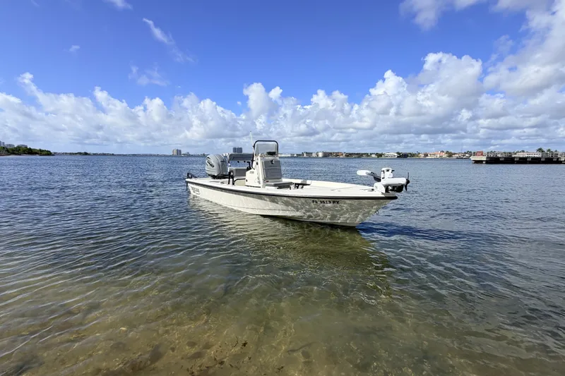 Slide: The Image of 2015 Pathfinder 2200 Tournament Edition boat on calm water under a blue sky. - 18