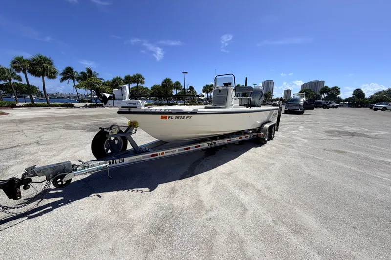 Slide: The Image of 2015 Pathfinder 2200 Tournament Edition boat on trailer in sunny parking lot. - 19
