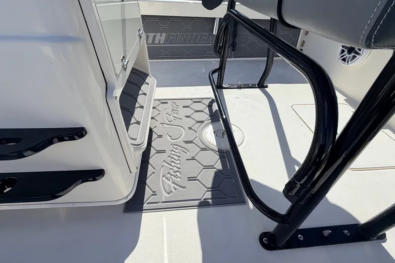Slide: The Image of 2015 Pathfinder 2200 Tournament Edition boat interior with fishing-themed mat and seating. - 33