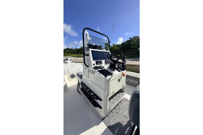 Slide: The Image of 2015 Pathfinder 2200 Tournament Edition boat console with steering wheel and navigation equipment. - 44