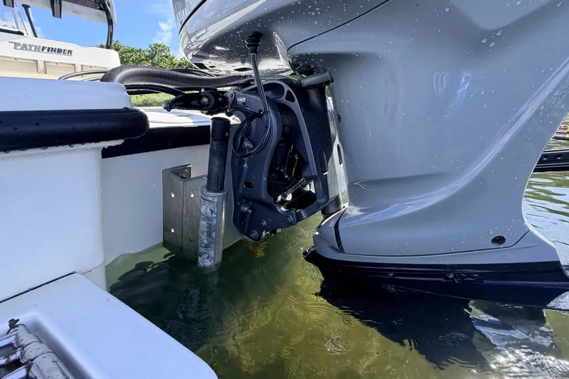 Slide: The Image of 2015 Pathfinder 2200 Tournament Edition boat engine in water, showcasing motor details. - 20