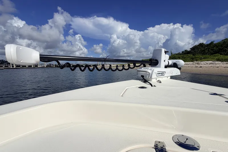 Slide: The Image of 2015 Pathfinder 2200 Tournament Edition boat with Minn Kota trolling motor on calm water. - 46