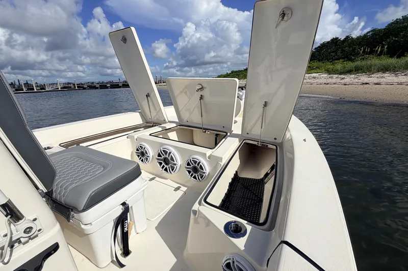Slide: The Image of 2015 Pathfinder 2200 Tournament Edition boat with open storage compartments and seating. - 39