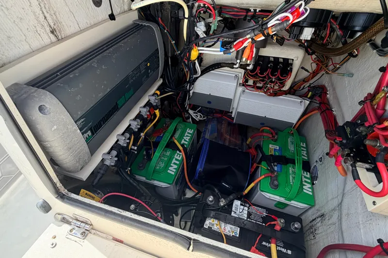 Slide: The Image of Electrical system of a 2015 Pathfinder 2200 Tournament Edition boat with batteries and wiring. - 49