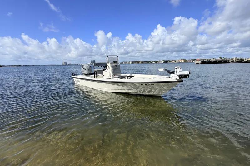 Slide: The Image of 2015 Pathfinder 2200 Tournament Edition boat on calm water under a blue sky. - 16