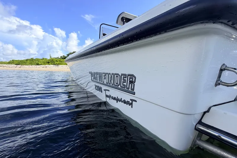 Slide: The Image of 2015 Pathfinder 2200 Tournament Edition boat on water, clear sky background. - 22