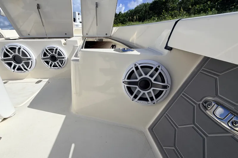 Slide: The Image of 2015 Pathfinder 2200 Tournament Edition boat with speakers and storage compartments. - 42