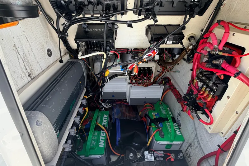 Slide: The Image of Electrical system of a 2015 Pathfinder 2200 Tournament Edition boat, featuring batteries and wiring. - 48