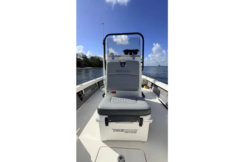 Slide: The Image of 2015 Pathfinder 2200 Tournament Edition boat on water, clear sky background. - 45