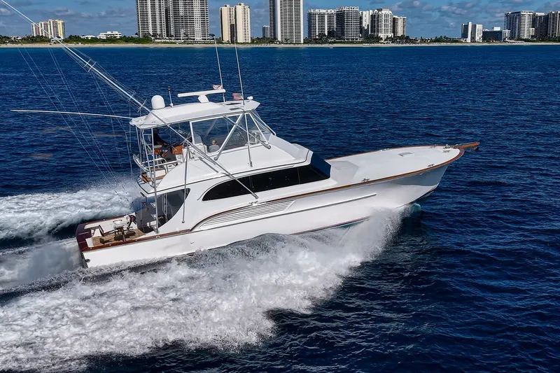 Slide: The Image of 1998 Buddy Davis 58 Sportfisherman cruising on ocean near city skyline. - 36